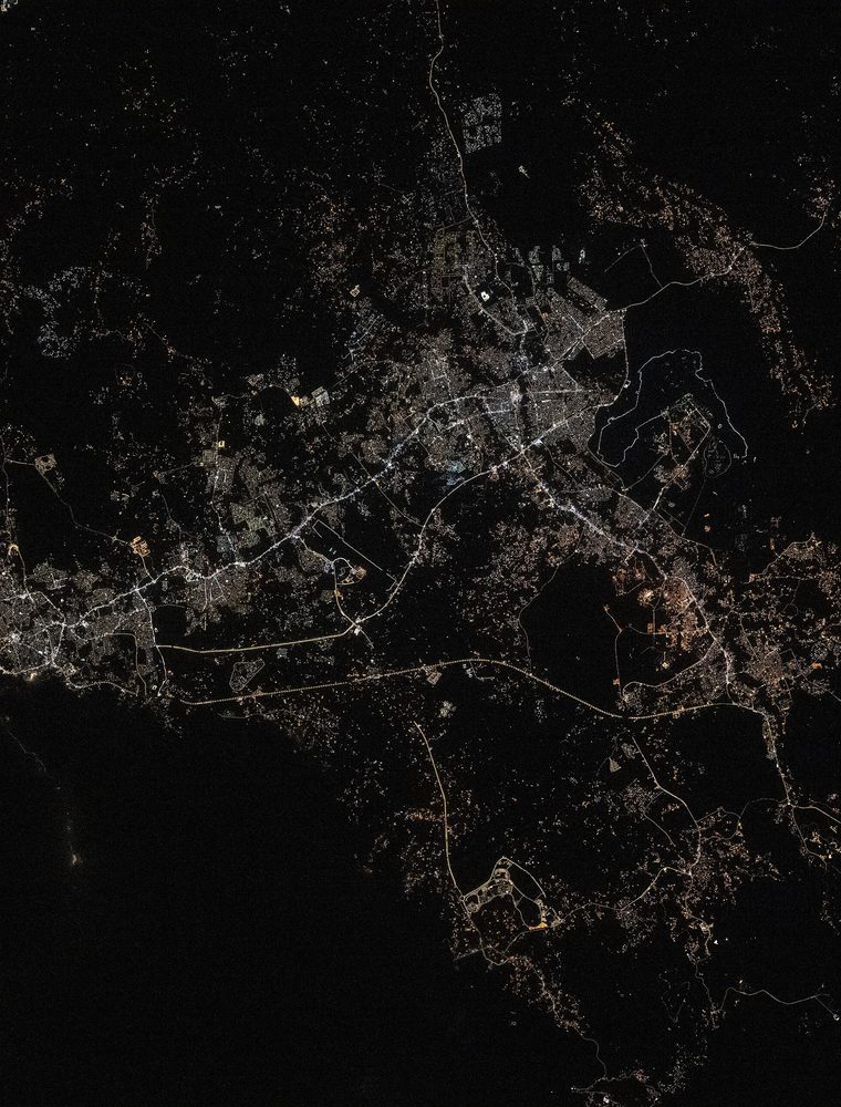Orbital night view of Saudi cities connected by threads of light.